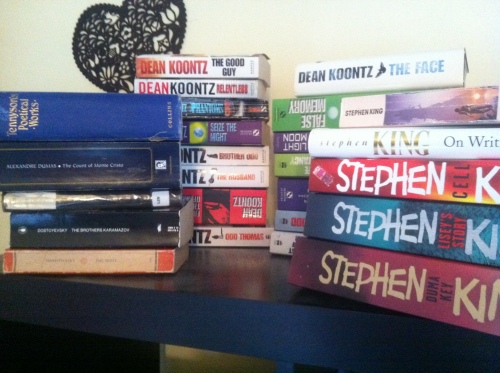 Piles of books by Stephen King, Dostoyevski and Dean Koontz